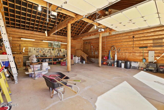 703 N Chaparral Pines Dr, Payson, AZ 85541 - garage with a garage door opener and a workshop area
