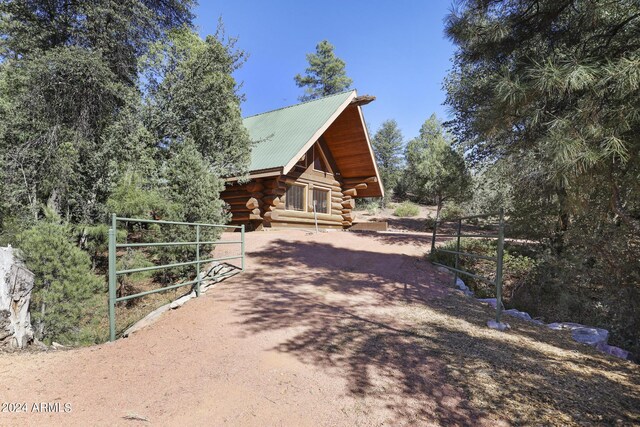 703 N Chaparral Pines Dr, Payson, AZ 85541 - exterior space featuring metal roof and log exterior