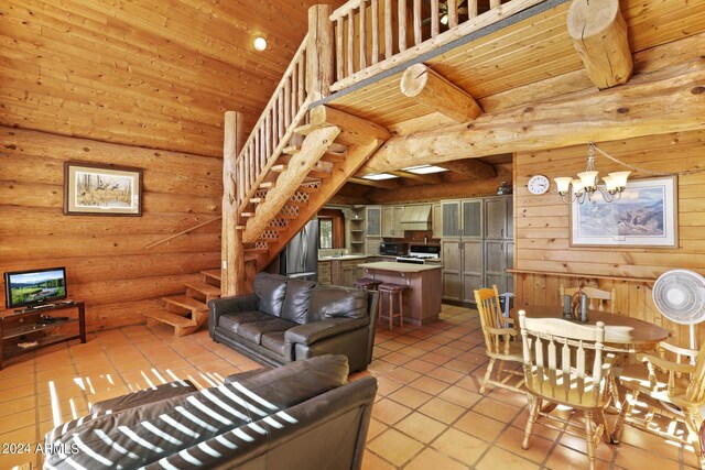 703 N Chaparral Pines Dr, Payson, AZ 85541 - living room featuring stairs, high vaulted ceiling, an inviting chandelier, and wood ceiling