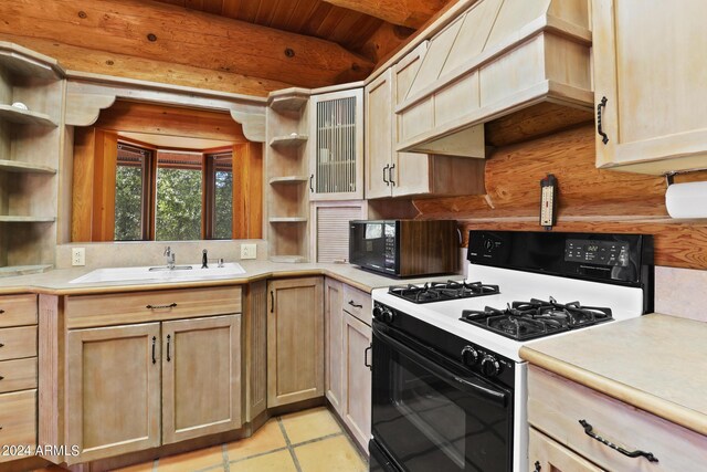 703 N Chaparral Pines Dr, Payson, AZ 85541 - kitchen with black microwave, range with gas cooktop, custom exhaust hood, and open shelves