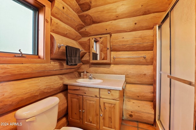 bathroom featuring an enclosed shower, vanity, and toilet