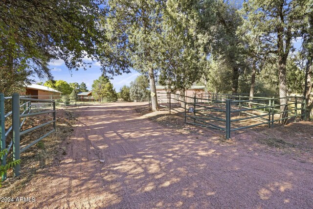 703 N Chaparral Pines Dr, Payson, AZ 85541 - view of street featuring an exterior structure, a rural view, and a gated entry