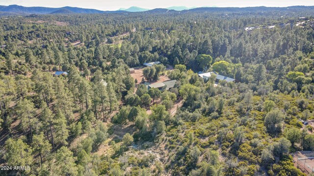 703 N Chaparral Pines Dr, Payson, AZ 85541 - drone / aerial view featuring a wooded view and a mountain view