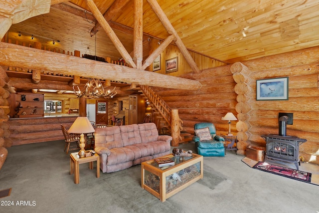 carpeted living room featuring a wood stove, a chandelier, high vaulted ceiling, log walls, and wooden ceiling