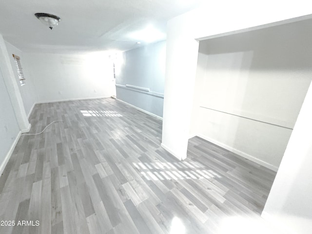 unfurnished room with hardwood / wood-style floors