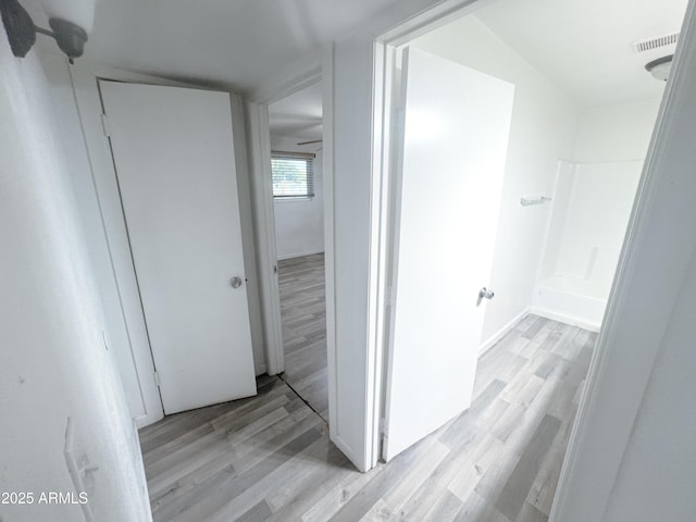 hall with light wood-type flooring