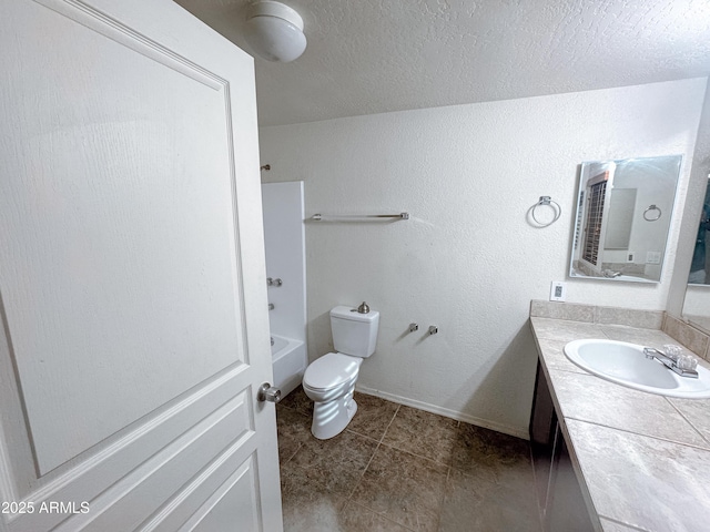 full bathroom with a textured ceiling, toilet, vanity, and bathing tub / shower combination