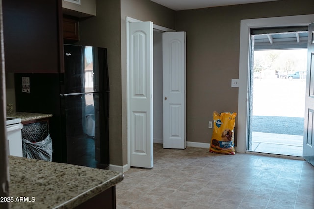 kitchen featuring light stone countertops