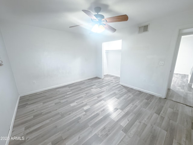 spare room with ceiling fan and light hardwood / wood-style floors