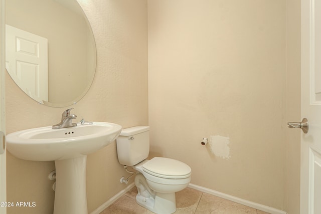 bathroom featuring toilet and tile patterned floors