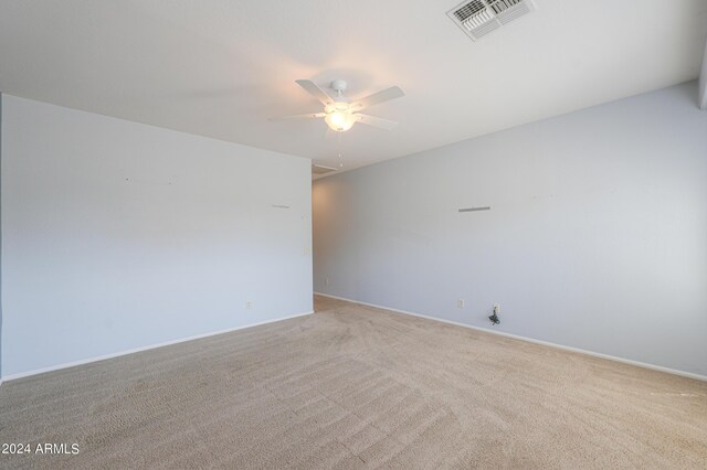 carpeted empty room with ceiling fan