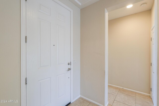 entrance foyer with light tile patterned floors