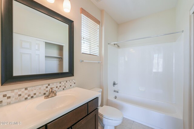 full bathroom with tasteful backsplash, tile patterned flooring, vanity, shower / bath combination, and toilet