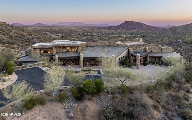 aerial view at dusk with a mountain view