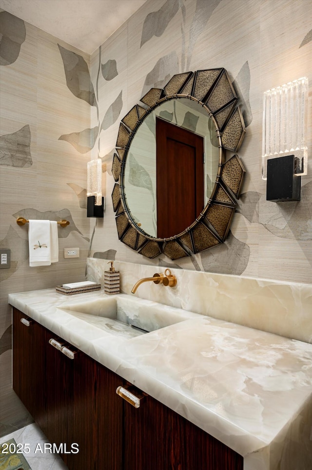 bathroom with tile walls and vanity