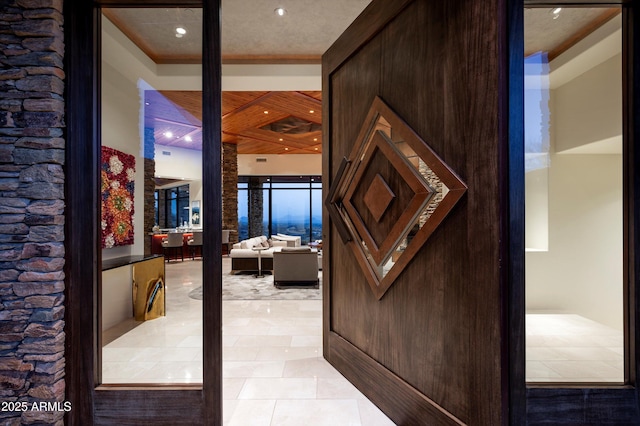 hall with light tile patterned floors and recessed lighting