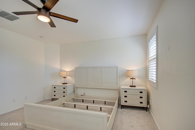 unfurnished bedroom featuring ceiling fan and light carpet