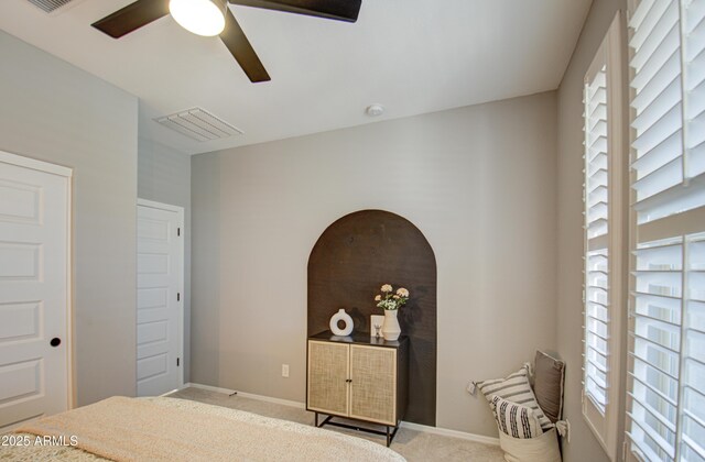 carpeted bedroom with ceiling fan