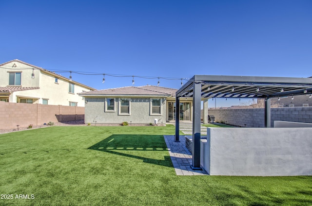 rear view of house featuring a lawn