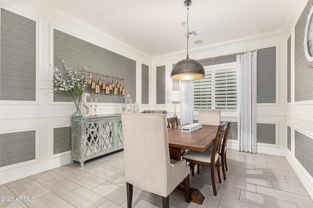 dining room featuring ornamental molding