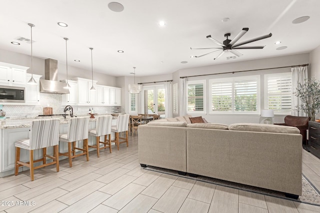 living room featuring ceiling fan