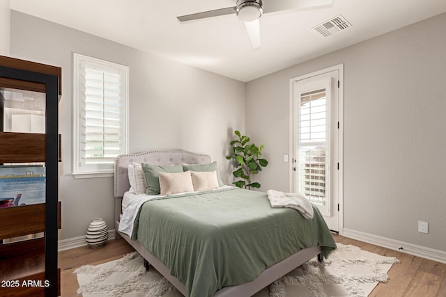 bedroom featuring hardwood / wood-style flooring and ceiling fan