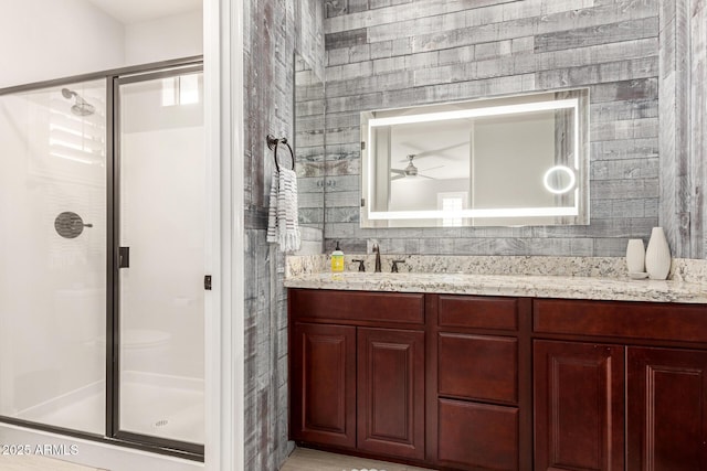 bathroom with vanity and an enclosed shower