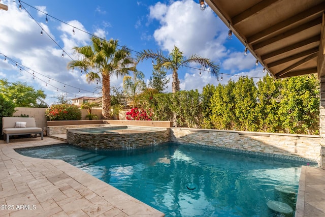 view of swimming pool with an in ground hot tub and a patio area