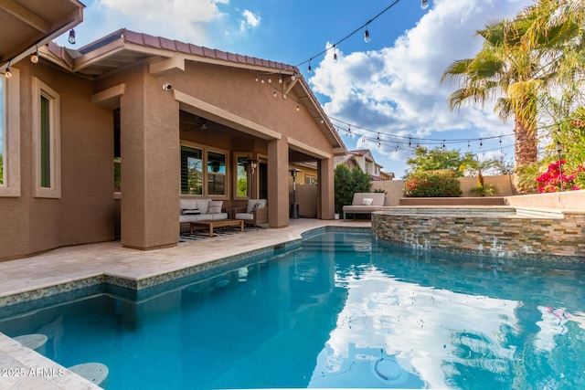 view of swimming pool with an outdoor living space, an in ground hot tub, and a patio