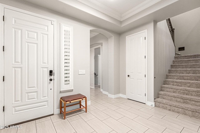 entrance foyer featuring crown molding