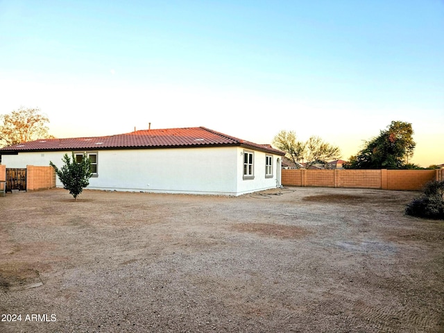 view of property exterior at dusk