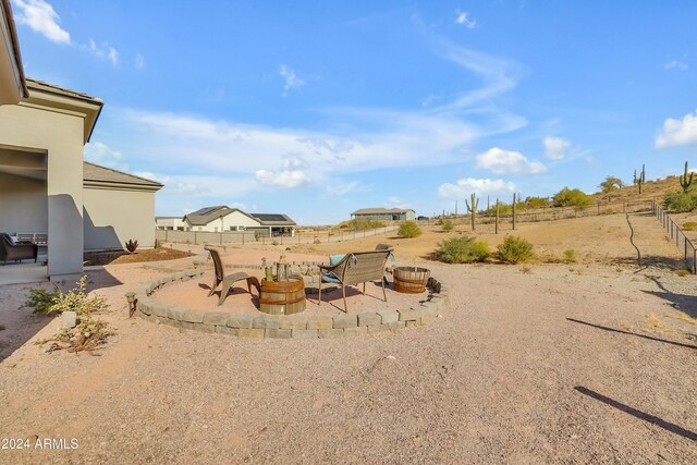 view of yard featuring a patio area and an outdoor fire pit