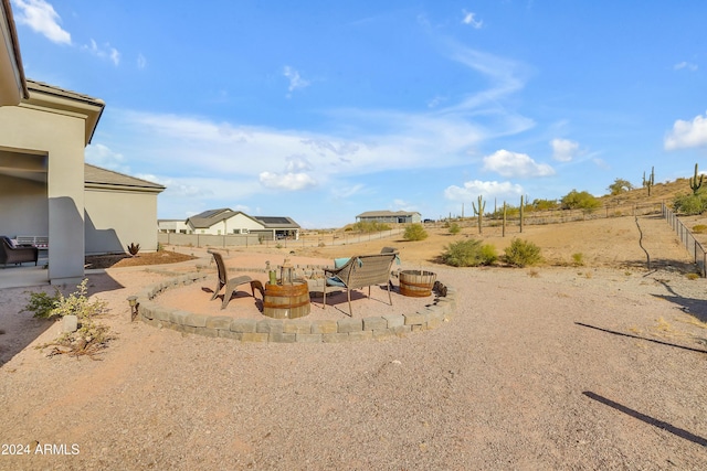 view of yard featuring a patio area and an outdoor fire pit