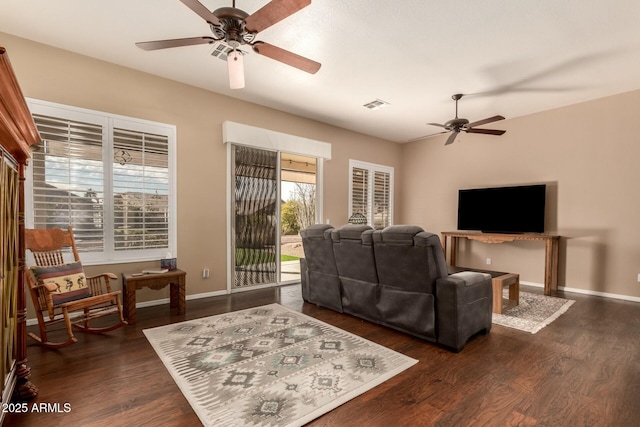 living room with dark hardwood / wood-style floors and ceiling fan