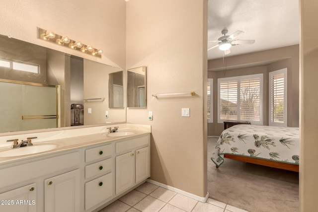 bathroom with ceiling fan, vanity, and tile patterned flooring