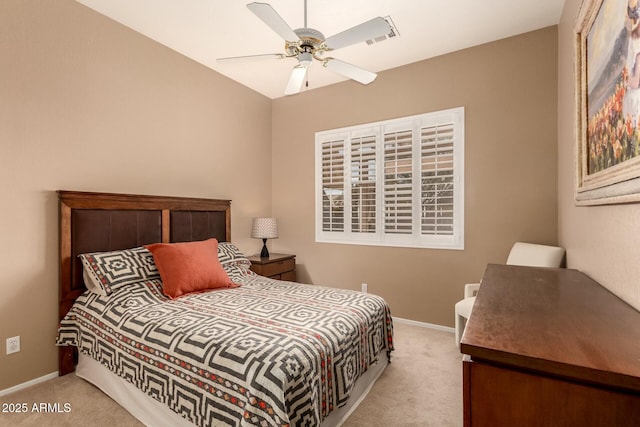 bedroom with ceiling fan and light colored carpet