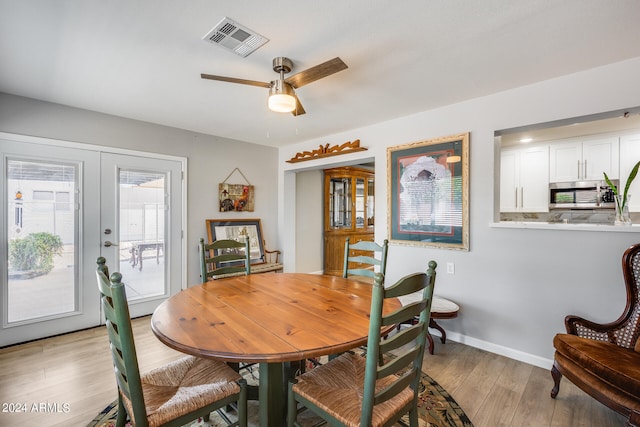 dining room featuring ceiling fan and light hardwood / wood-style floors