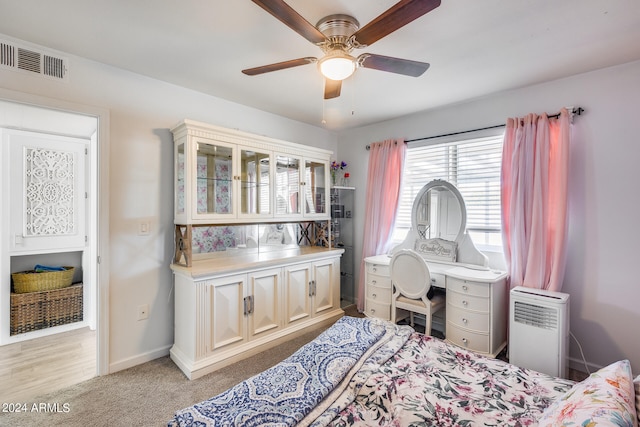 bedroom with ceiling fan and light hardwood / wood-style floors