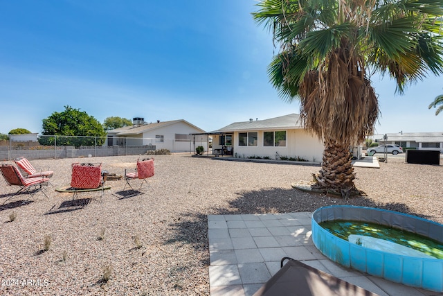 view of yard with a patio area and a swimming pool