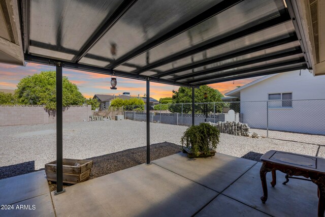 view of patio terrace at dusk