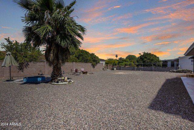 view of yard at dusk