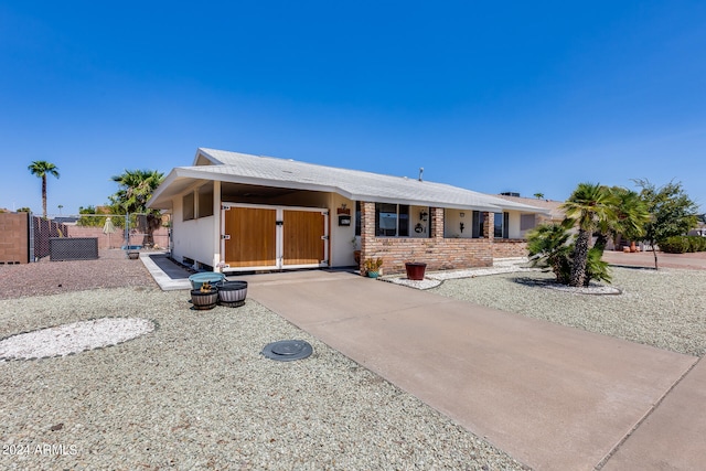 view of front of property featuring a carport