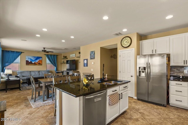 3936 E Narrowleaf Dr, Gilbert, AZ 85298 - kitchen featuring stainless steel appliances, a sink, a ceiling fan, recessed lighting, and white cabinets