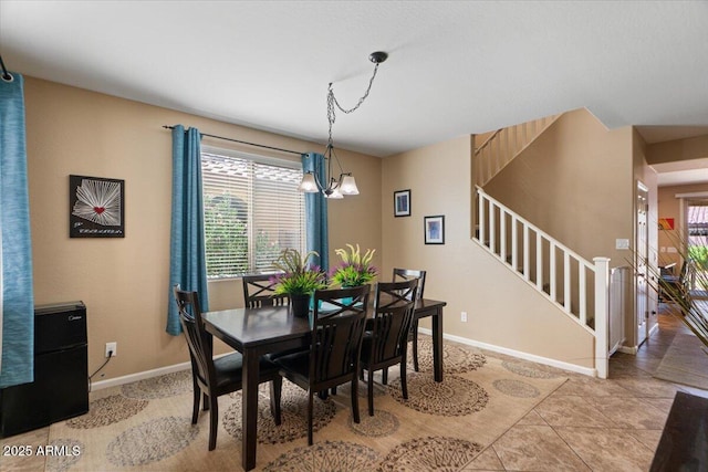 3936 E Narrowleaf Dr, Gilbert, AZ 85298 - dining area featuring stairway, baseboards, and a chandelier
