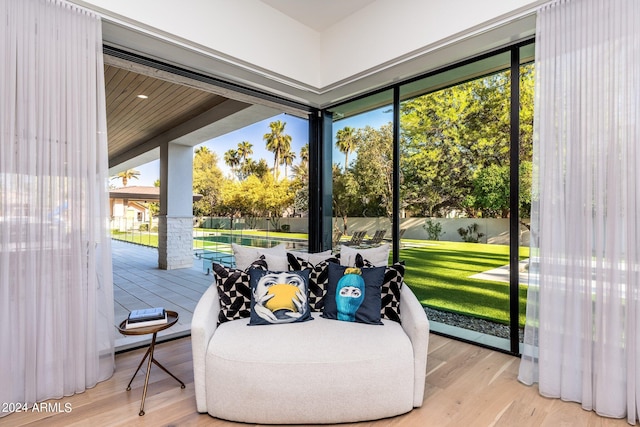 sunroom with a swimming pool