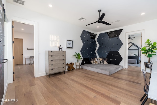 interior space featuring light wood-type flooring and ceiling fan