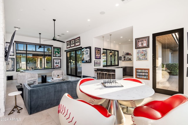 dining room featuring light tile patterned floors and ceiling fan