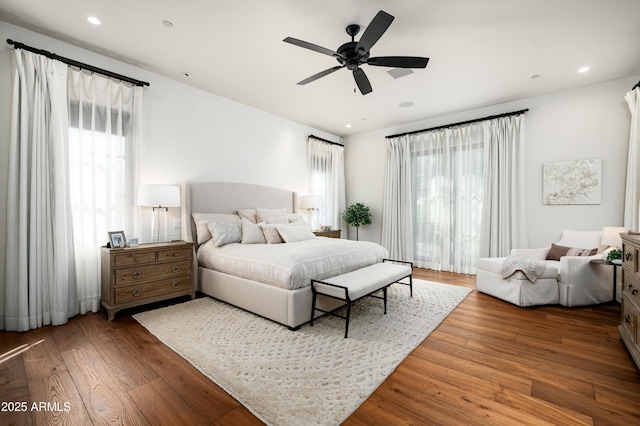 bedroom with visible vents, recessed lighting, a ceiling fan, and hardwood / wood-style floors