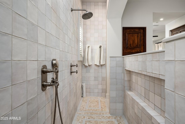 bathroom with a tile shower