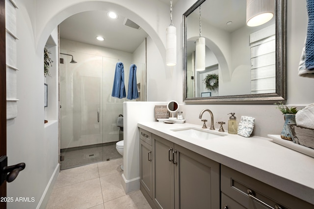 full bathroom with vanity, visible vents, a stall shower, tile patterned floors, and toilet